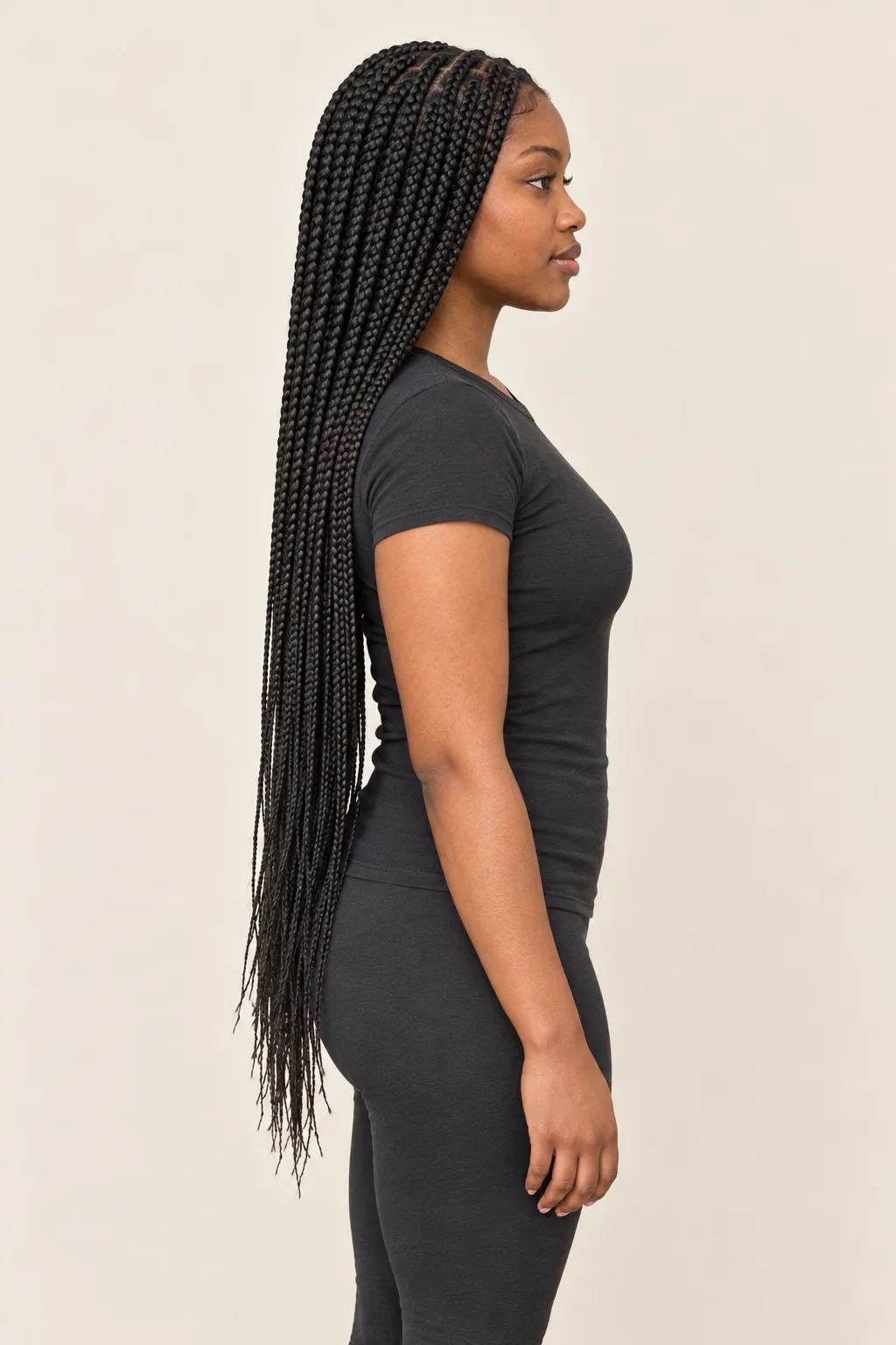 Side view showing long box braids and their sectioned installation.